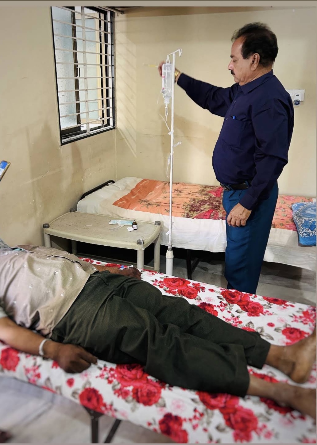 Dr. Bathvar administering IV therapy to a patient at Pankh Clinic